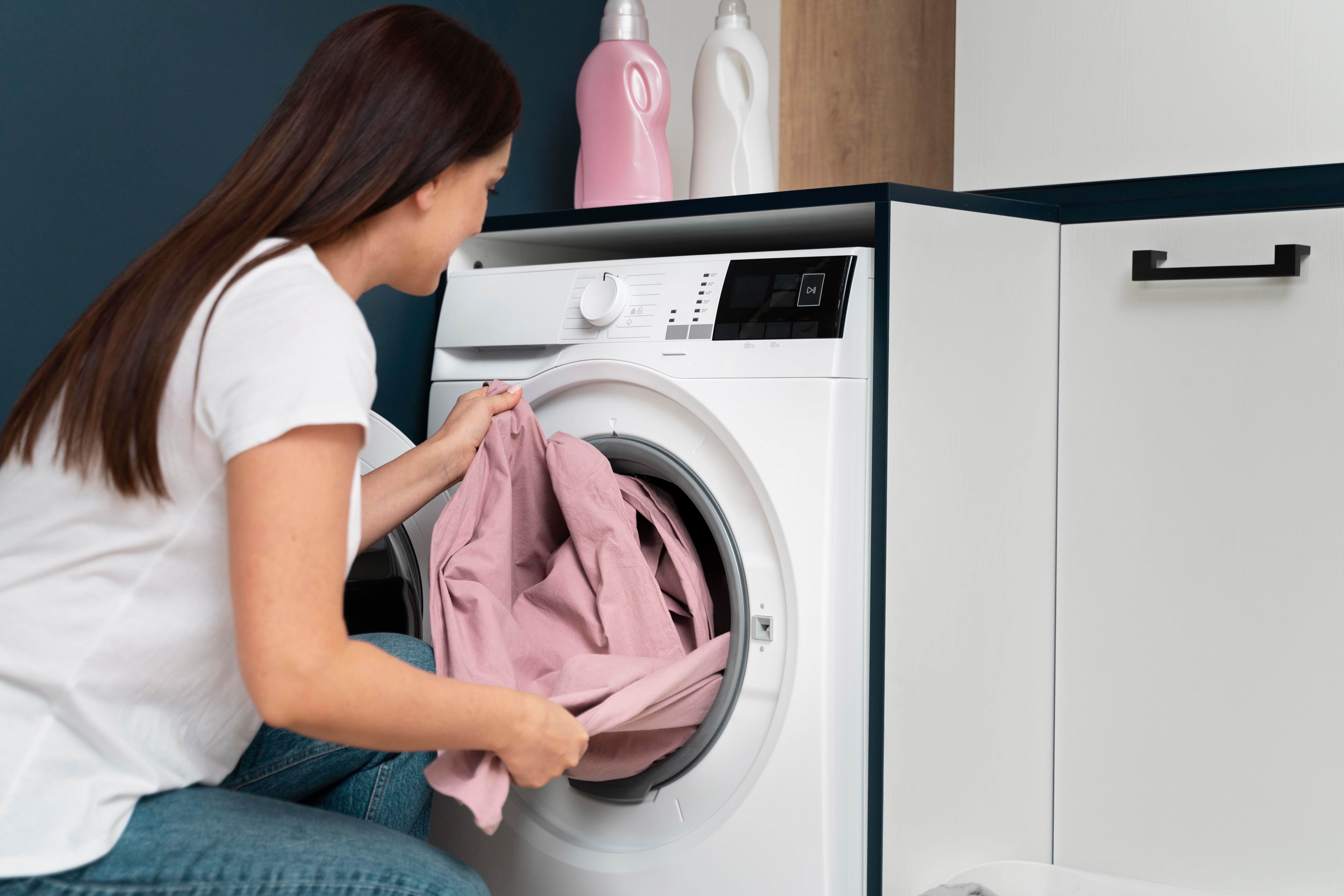 woman-taking-clothes-from-washing-machine.jpg